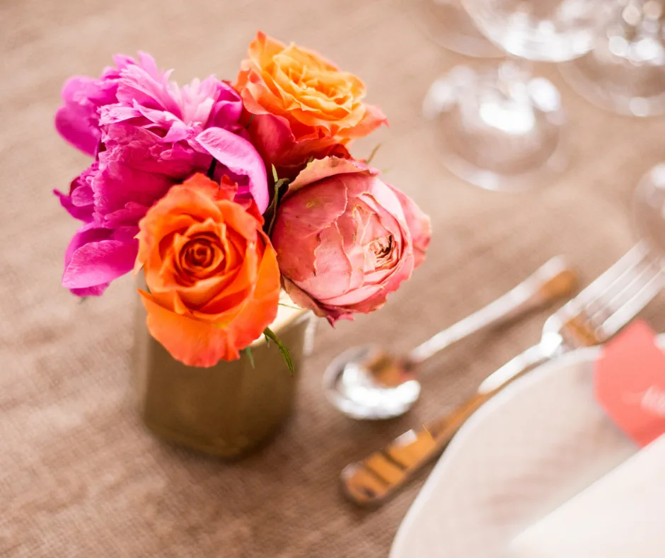 featured image showing flowers in a diy bunch on a table for a wedding.