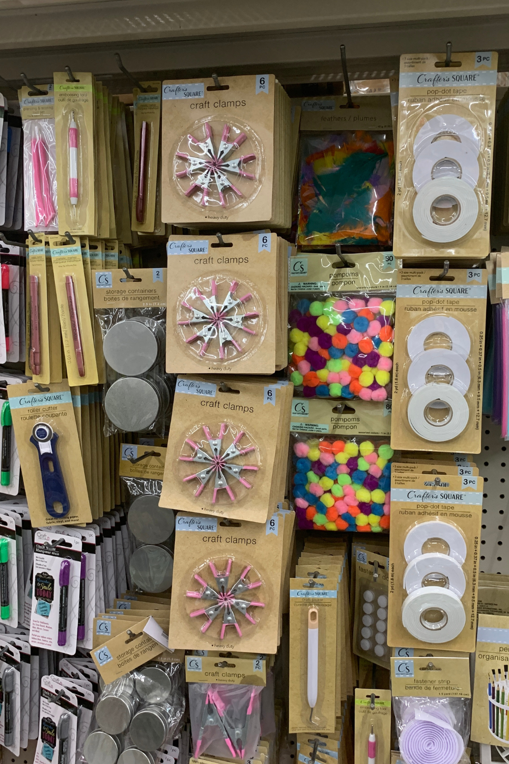 assorted hanging craft supplies at dollar tree store